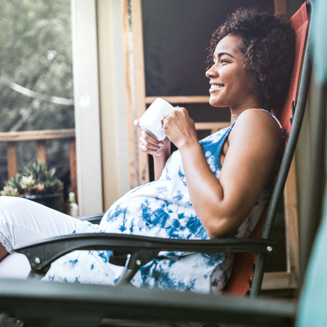 Pregnant women sitting and drinking tea