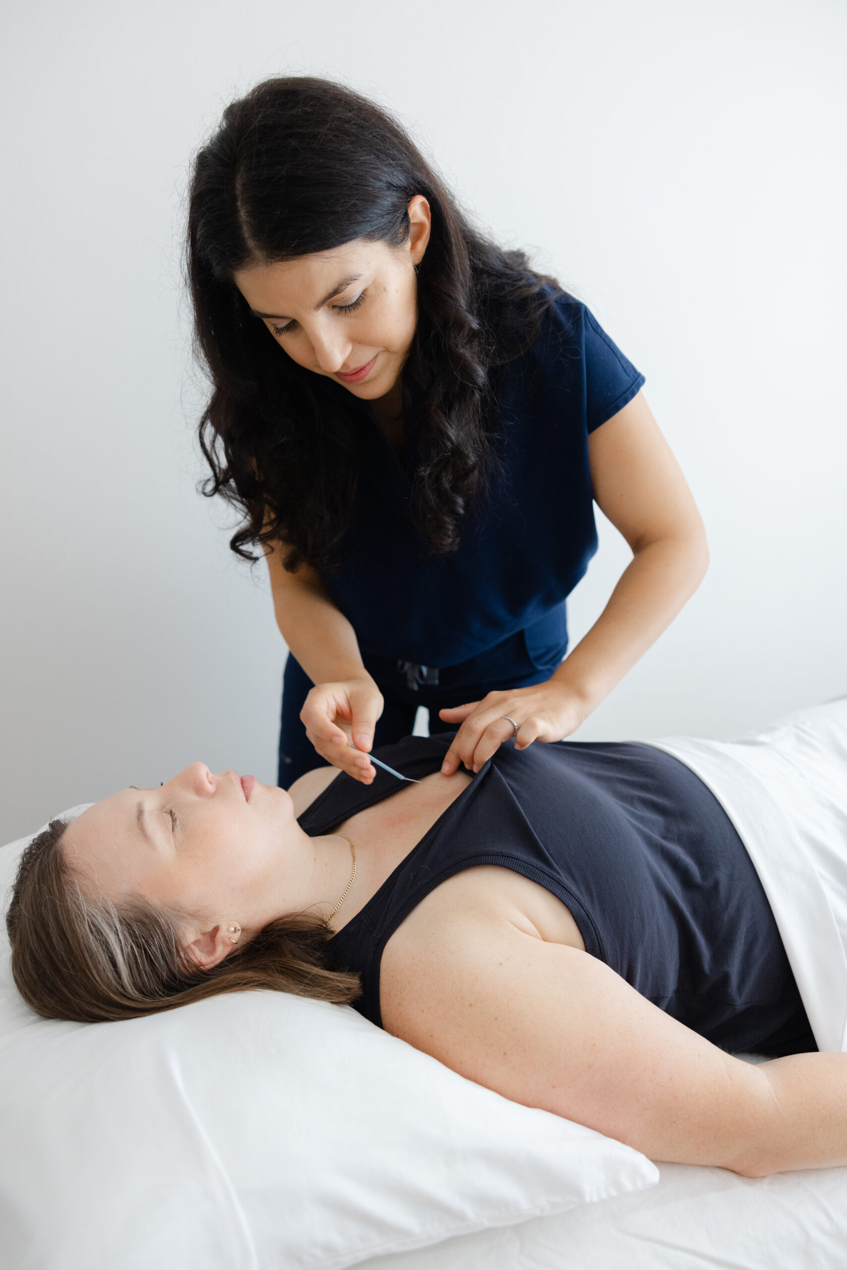 Dr. Natalie Grigorian providing acupuncture treatment for endometriosis pain relief at Aetherium Washington DC